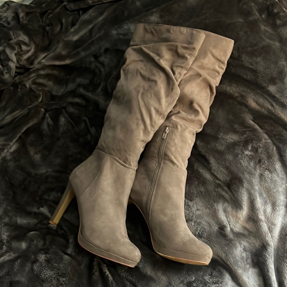 Tan boots up to the knee